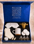 All seven items of the First Semester Survival care package arranged inside the open Gitano Kit gift box