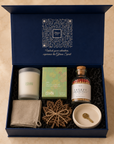 Inside the Gitano Kit box — New-Home Ritual housewarming gift set nestled in black crinkle paper with QR lid artwork