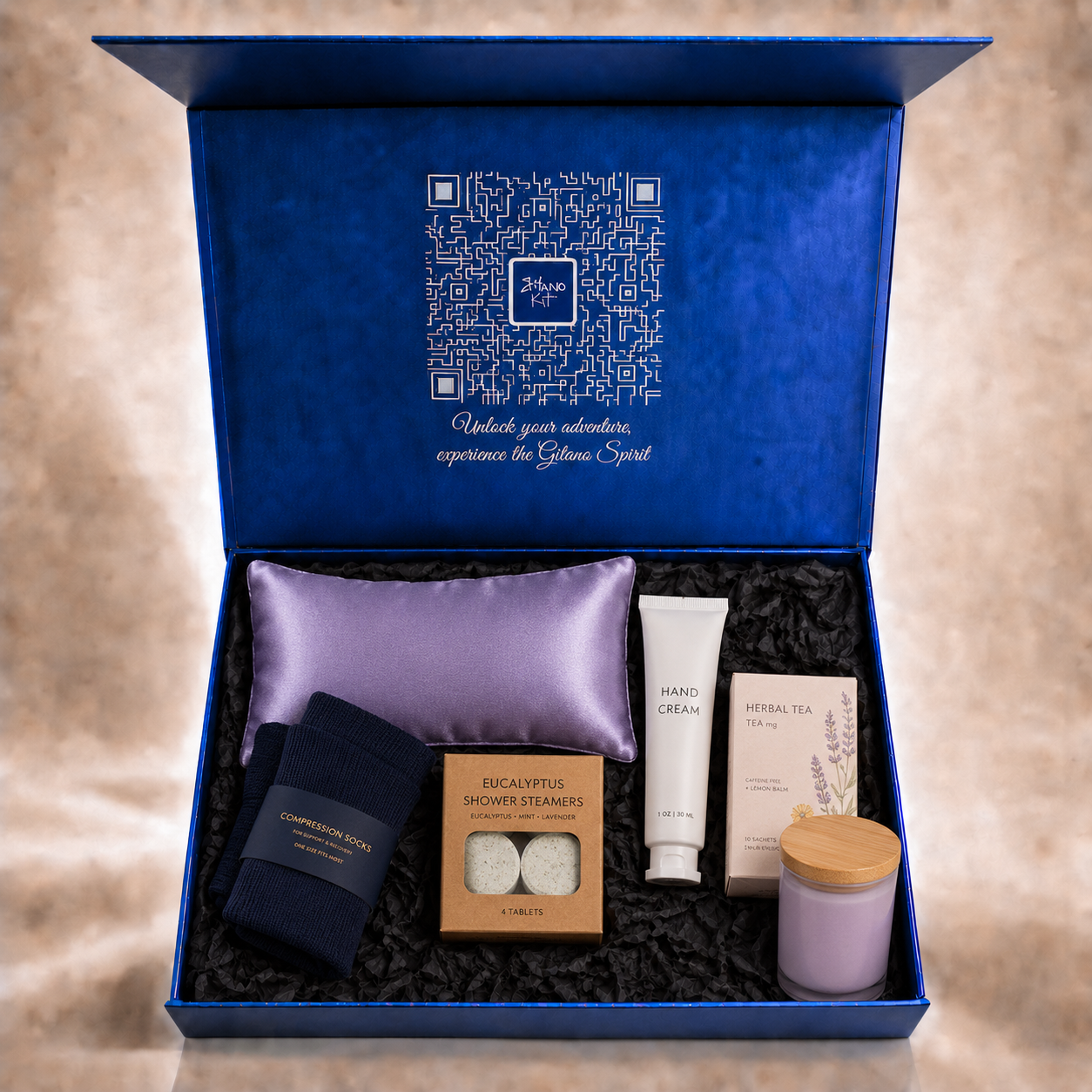 Code Calm nurse gift set inside the open Gitano Kit navy gift box with signature QR lid — post-shift recovery essentials nestled in black tissue