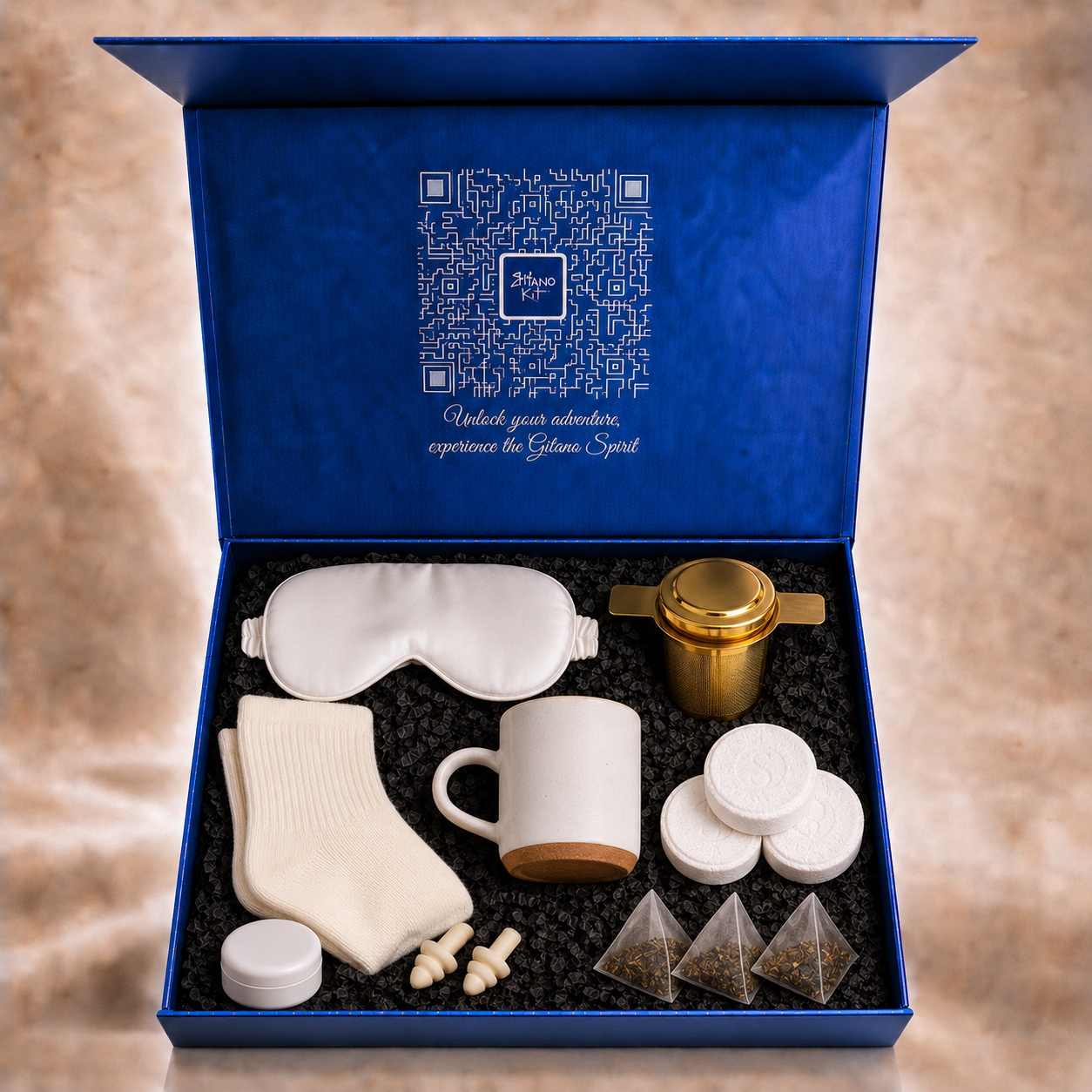 All seven items of the First Semester Survival care package arranged inside the open Gitano Kit gift box