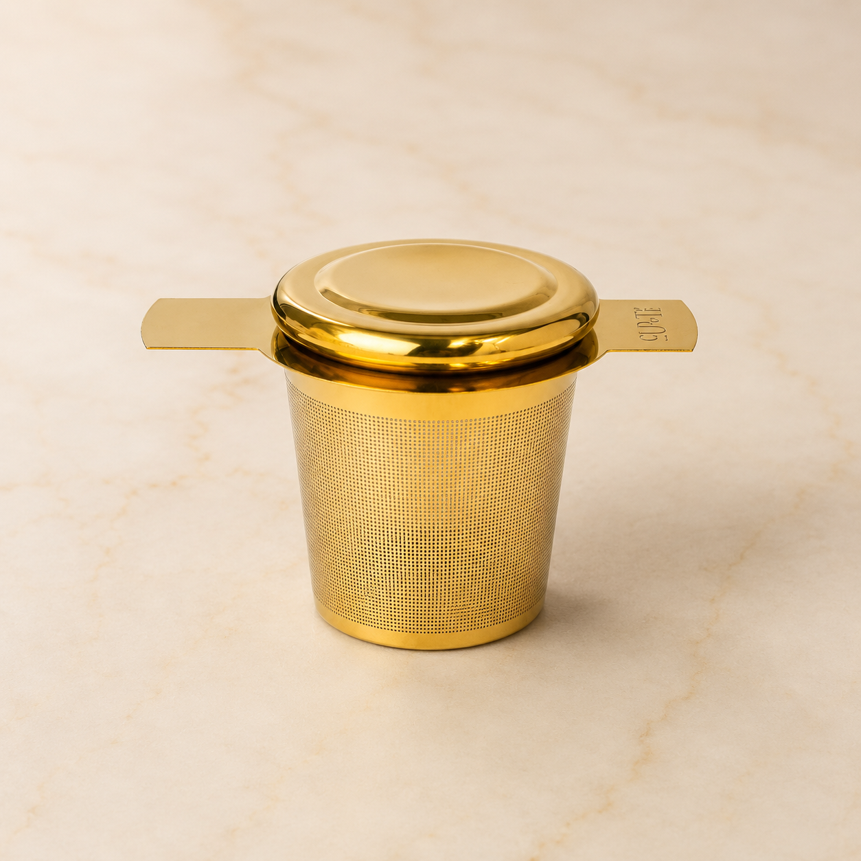 Gold stainless-steel tea infuser — First Semester Survival university care package