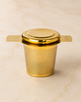 Gold stainless-steel tea infuser — First Semester Survival university care package