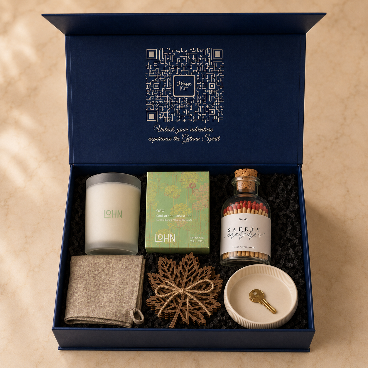 Inside the Gitano Kit box — New-Home Ritual housewarming gift set nestled in black crinkle paper with QR lid artwork